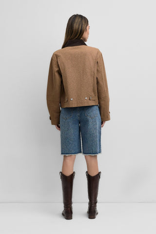 Back view of the Barn Jacket is a work-style zip-up jacket showing adjustable button-back hem and sleeve cuffs for added utility.