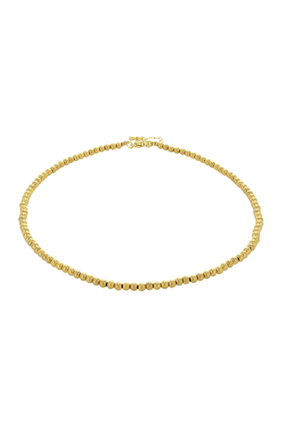 Gold necklace on a white background