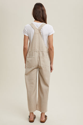 gingham denim overalls shown on model in size small, back view showing pockets