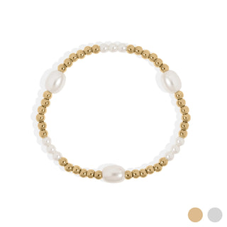Bracelet with gold beads and pearls on a white background