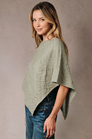 CABLE KNIT PONCHO SWEATER