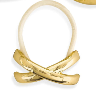 Three gold rings with unique designs on a white background
