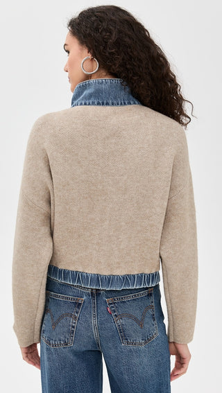 Back view of the BLANKNYC Glow Up Sweater, highlighting its soft knit texture, and contrast denim detailing. Designed for a cozy yet elevated look.