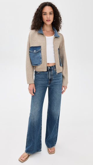 Detail open front view of the BLANKNYC Glow Up Sweater, showcasing its soft knit texture, ribbed detailing, and contrast denim pockets and collar. Designed for a cozy yet elevated look.