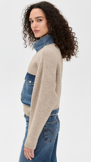 Detail side view of the BLANKNYC Glow Up Sweater, highlighting its soft knit texture, ribbed detailing, and contrast denim pockets and collar. Designed for a cozy yet elevated look.