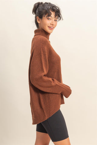 Woman wearing a brown sweater on a beige background