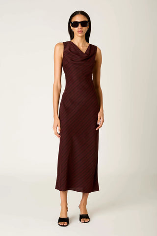 Woman wearing a brown dress on a white background