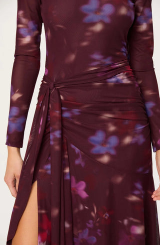 Maroon dress with floral pattern and slit on a white background