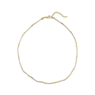 Delicate gold necklace on a white background
