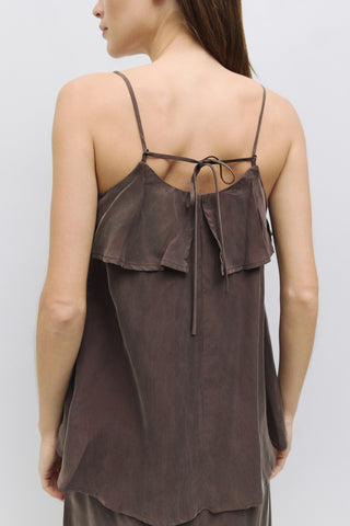 Back view of brown tank with spaghetti straps, soft ruffle overlay, and tie-back detail