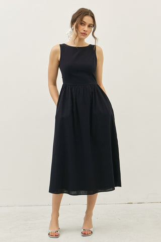 Sleeveless black cotton midi dress with fitted bodice and full skirt