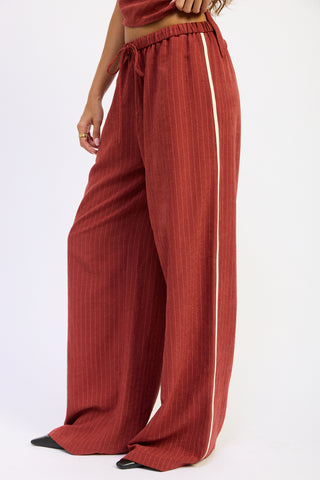 Red striped pants with a white background