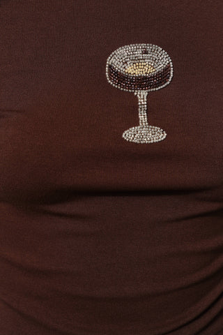 Brown shirt with a rhinestone-embellished cocktail glass design on a plain background