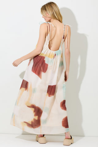 Back view of Fayola watercolor maxi dress with low scoop back and tie-shoulder straps