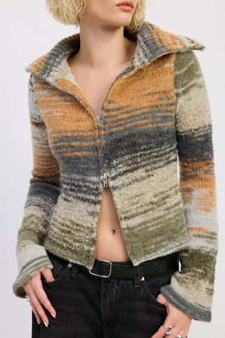 Person wearing a patterned jacket with a white background