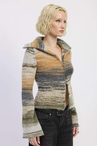 Woman wearing a patterned jacket on a white background