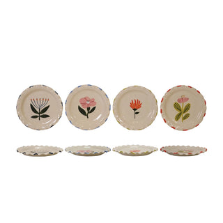 Set of five ceramic plates with floral designs on a white background
