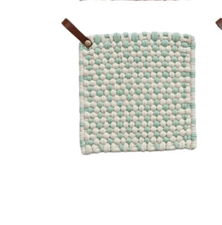 Single light blue and white cotton crochet pot holder with leather loop, displayed against white background.